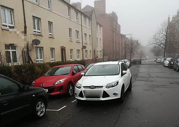 Lidia's red Mazda was blocked in due to the double parking from the driver of the white Ford Focus. Picture: Submitted