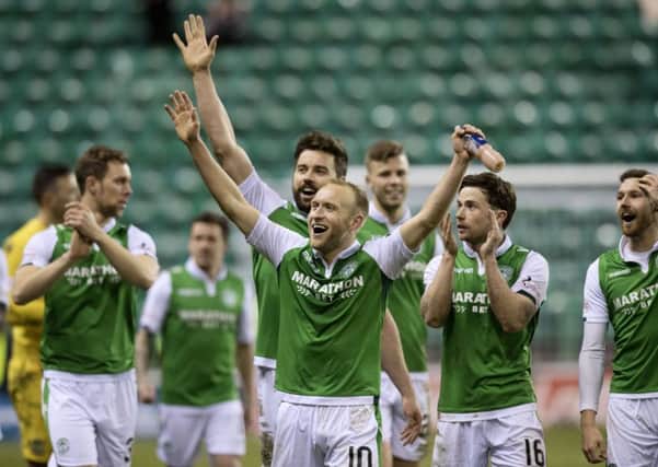 Dylan McGeouch celebrates with his team-mates after Hibs record a 2-0 win over Hearts. Picture: SNS Group