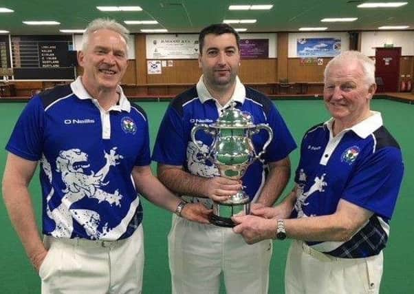 Mark Johnston, Derek Oliver and Willie Wood MBE show off the British Isles triples trophy