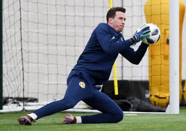 Jon McLaughlin shows off his safe hands during training with Scotland. Pic: SNS