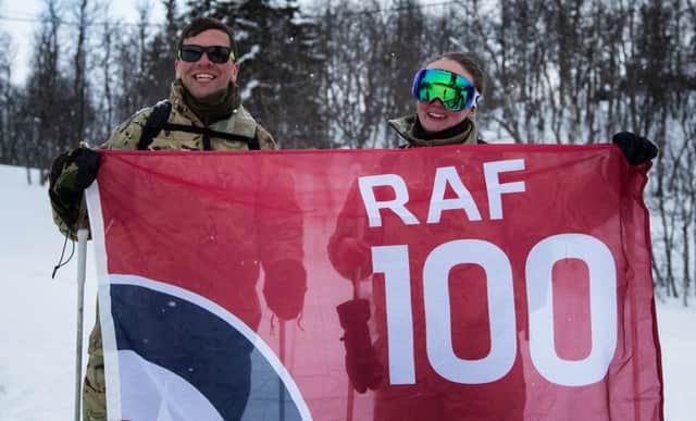 Edinburgh RAF reservists Flt Lt Fiona Wright and SAC Craig Young with the RAF100 flag