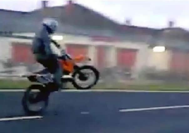 A still from a video of boy racers from Pilton riding motorbikes and quad bikes.