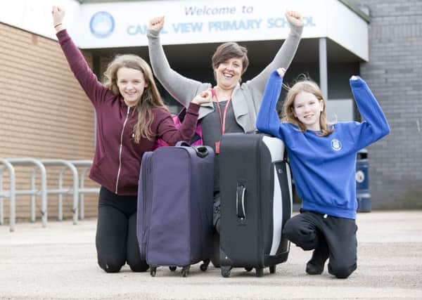 Headteacher Ann Moore with pupils Kiera Wall, left, and Abbie-Leigh Radcliffe