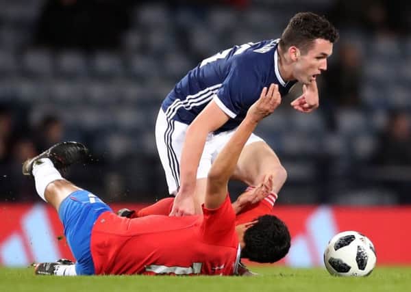 Hibs and Scotland midfielder John McGinn challenges Yeltsin Tejeda during the 1-0 defeat by Costa Rica. Pic: SNS