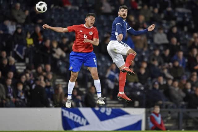 Former Hearts defender Callum Paterson competes with Oscar Duarte. Pic: SNS