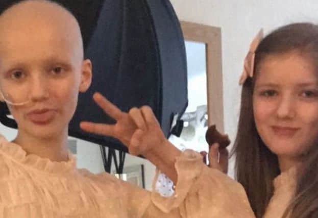 Edinburgh twins Sophie (left) and Megan (right). Megan appeared to take on Sophie's cancer symptoms before any diagnosis. Picture: JustGIving