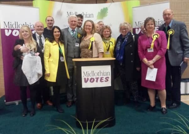 The SNP celebrate with Cllr Joe Wallace (centre)