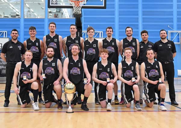 Edinburgh Kings, with coach Craig Nicol on the right, show off their cup