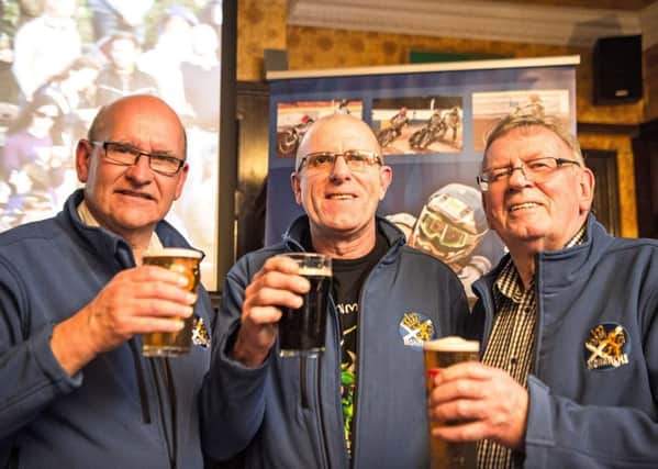 Monarchs directors John Campbell and Alex Harkess flank Staggs Bar proprietor Nigel Finlay as they toast their new deal. Pic: Ron MacNeill
