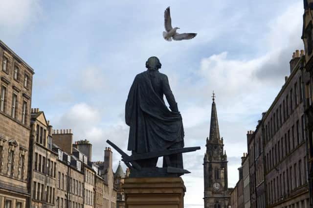 The ideas of economist Adam Smith, whose statue is given pride of place on the Royal Mile, helped shape the modern world (Picture: Phil Wilkinson)