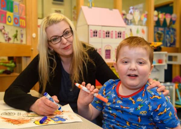 Karen Gray at the Sick Kids Hospital with her son, Murray, who has a rare form of epilepsy