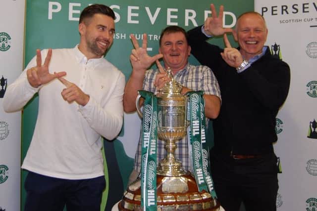 Hibs' Darren McGregor, Citadel General Manager Willy Barr and John (Yogi) Huges bring the Scottish Cup to Leith's Citadel Youth Centre
