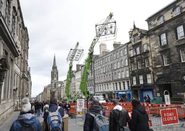 Trucks, cranes, lights and police boxes on the Royal Mile for filming of The Avengers movie. Picture: Greg Macvean