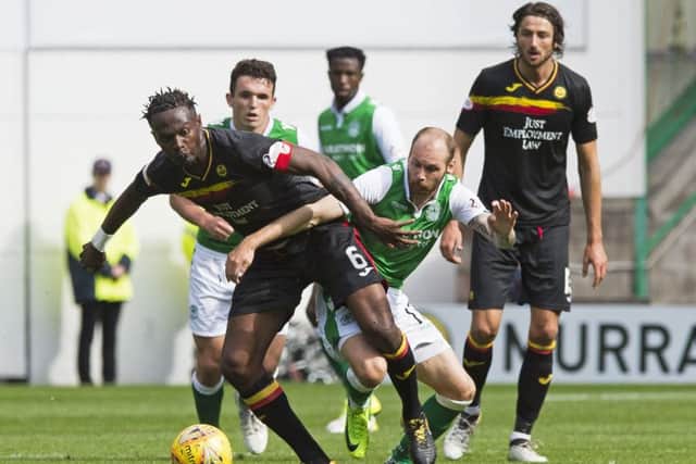 Martin Boyle, right, battles for possession with Abdul Osman during Hibs' victory over Thistle on opening day. Picture: SNS