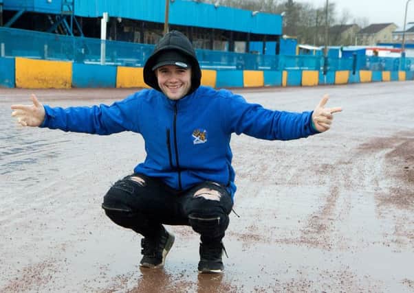 Edinburgh captain Erik Riss is all smiles despite the rain-soaked track. Pic: Ron MacNeill
