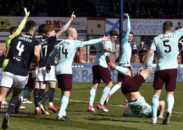 Dundee and Hearts claim for a decision at Dens Park. Pic: SNS
