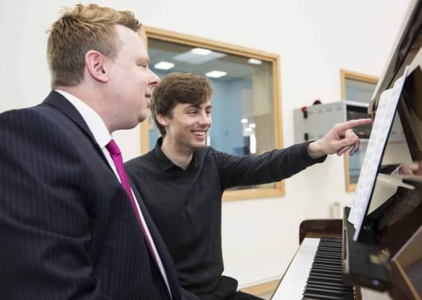 Connor Wilcox with Mikael Petersson, music planning co-ordinator and pianist at Elmhurst