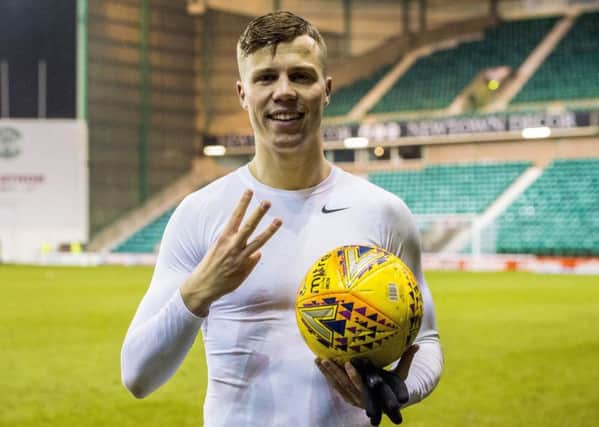 Florian Kamberi shows off the match ball following his hat-trick against Hamilton. Pic: SNS
