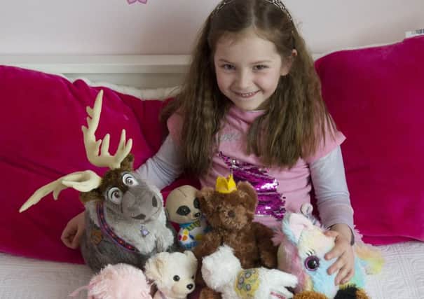 Alyssa Bennett took a long time to decide which of her furry friends she would donate to charity, Picture: Ian Rutherford
