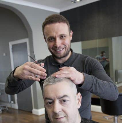 Keith Love, the Edinburgh hairdresser, offers homeless people a free haircut. Picture: TSPL