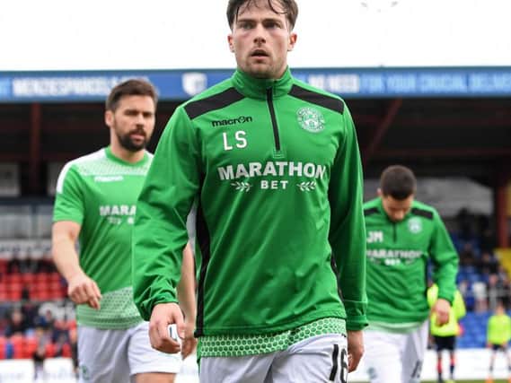Lewis Stevenson gets ready for his 400th appearance for Hibs against Ross County in Dingwall this afternoon