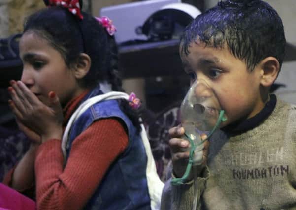 A child receives oxygen following an alleged poison gas attack that killed at least 40 people in the rebel-held town of Douma, near Damascus, Syria. (Picture: Syrian Civil Defence White Helmets via AP)