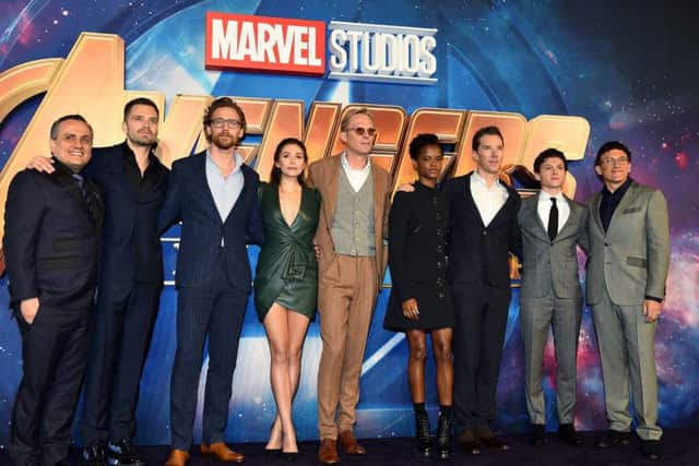 (l to r) Joe Russo, Sebastian Stan, Tom Hiddleston, Elizabeth Olsen, Paul Bettany, Letitia Wright, Benedict Cumberbatch, Tom Holland and Anthony Russo attending the Avengers: Infinity War UK Fan Event held at Television Studios in White City, London.
