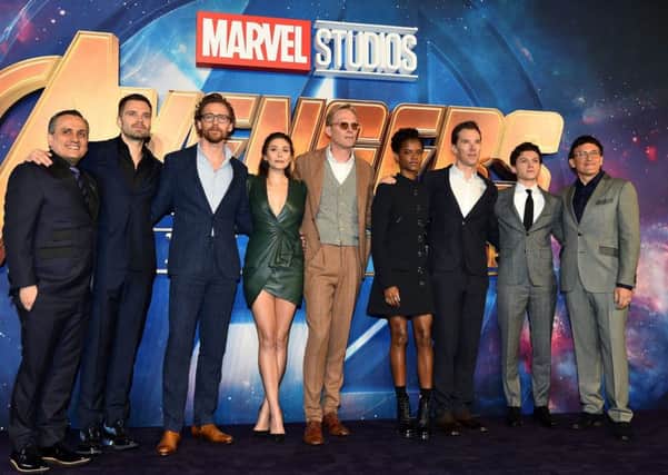 (l to r) Joe Russo, Sebastian Stan, Tom Hiddleston, Elizabeth Olsen, Paul Bettany, Letitia Wright, Benedict Cumberbatch, Tom Holland and Anthony Russo attending the Avengers: Infinity War UK Fan Event held at Television Studios in White City, London.