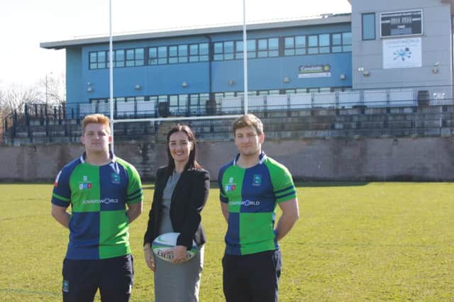 Melissa Singh pictured with Boroughmuir Rugby Club players
