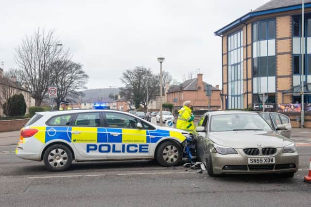 A collision between a police car and a BMW on Stenhouse Road. Picture: Ian Georgeson