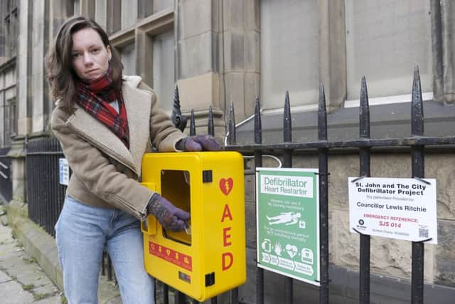 McDonald Library advisor Chris Young beside the vandalised defibrilator housing. Picture: Neil Hanna