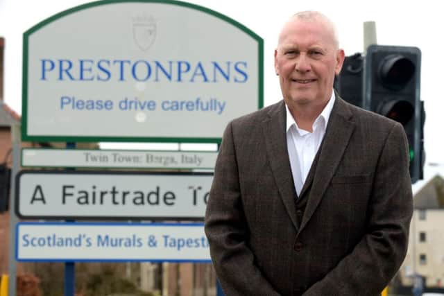 Prestonpans Community Councillor Brian Weddell and the area that is being proposed for a cruise liner depot. Picture: Lisa Ferguson
