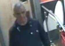 A CCTV image of a man leaving the McDonald's toilets in Waverley Mall. The man is being sought by police
