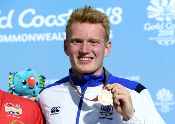 James Heatly shows off his bronze medal
