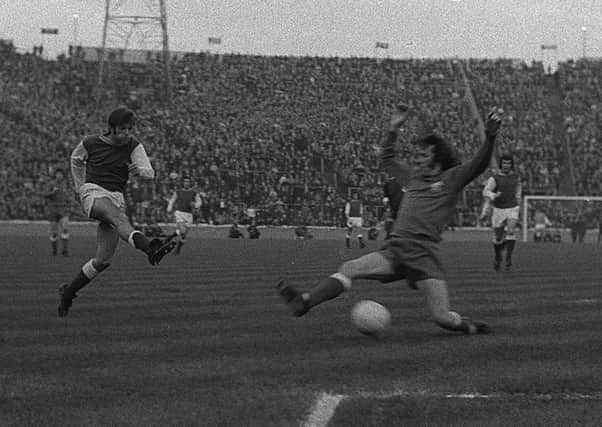 Hibs midfielder Pat Stanton smashes in the first goal against Rangers in front of 57,000 fans inside Hampden