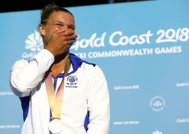 Grace Reid reacts on top of the podium after winning Commonwealth Games gold