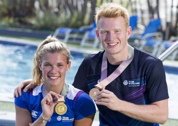 Grace Reid and James Heatly show off their medals