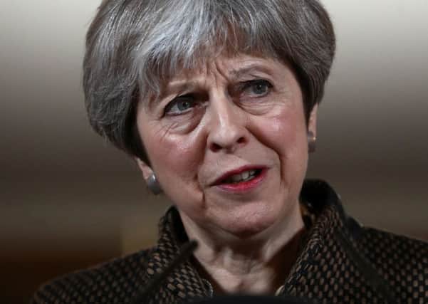Theresa May announces at a Downing Street press conference that British jets had bombed chemical weapon plants in Syria. Picture: AFP
