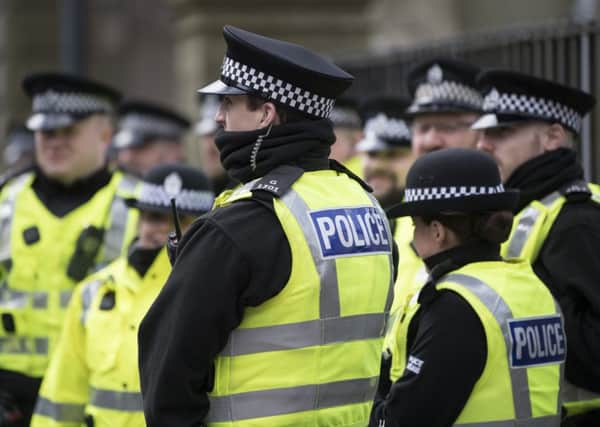 Police officer numbers may be stable but the backroom staff they need are being cut. Picture: John Devlin