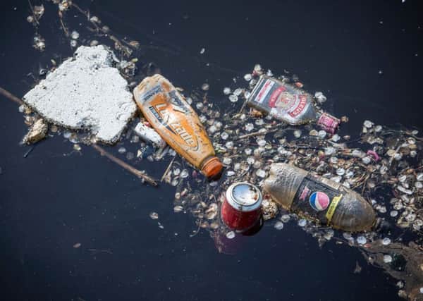 Plastic bottles and other rubbish floating in Leith Docks outside the Customs House where Greenpeace launched their End Oceans Plastics campaign.