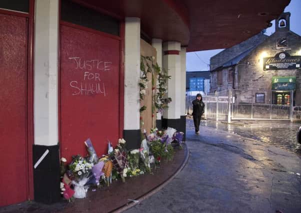 The memorial for Shaun Woodburn outside the old cinema in Great Junction St. Picture: Alistair Linford