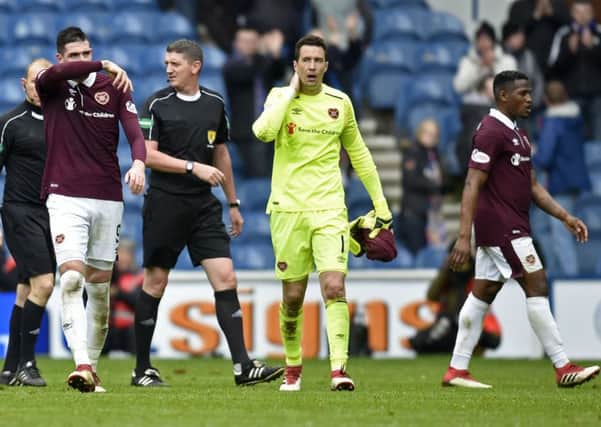 The Hearts players leave the pitch at full time following a lacklustre display