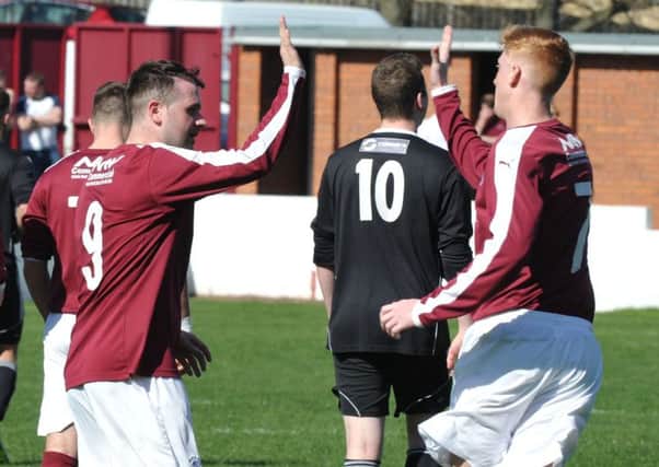 Linlithgow's Colin Strickland, left, celebrates with Owen Ronald after scoring Rose's third goal. Pic: Ian Rutherford