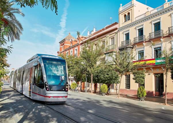 A tram makes its way through Seville