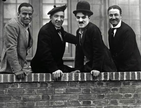 Sir Harry Lauder (second left) with Sir Charlie Chaplin (second right). Picture: PA