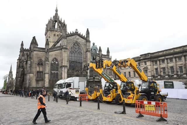Trucks, cranes, lights and police boxes on the Royal Mile for filming of The Avengers movie