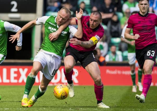 Scott Brown, right, battles with Hibs' Dylan McGeouch