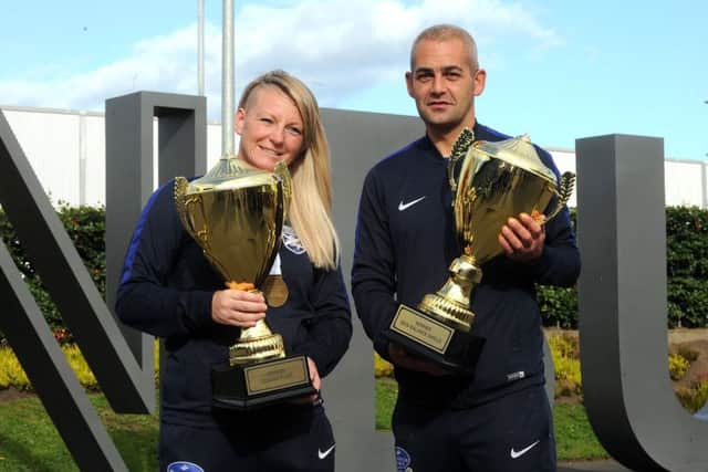 Ladies Captain Barbara Geddes and Mens Captain Steven Kelly with the trophys   Homeless World Cup teams return home