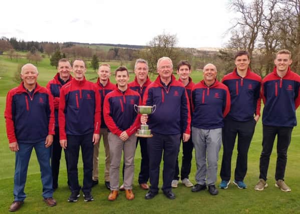 Captain Graeme Stark shows off the Inter-Cities Cup flanked by his triumphant Mortonhall team at Balmore