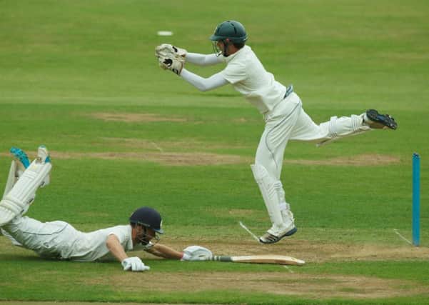 Keith Morton dives to make the crease and avoid being run out